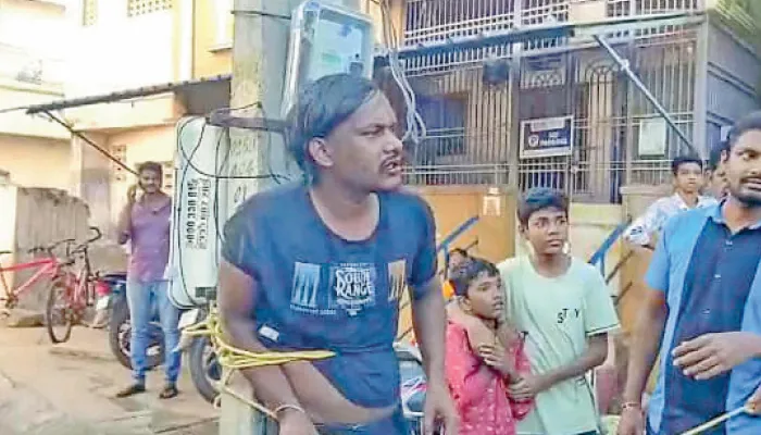 சிறுமியை பலாத்காரம் செய்ய முயன்ற வாலிபரை கம்பத்தில் கட்டி அடி, உதை